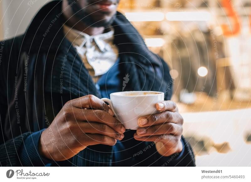 African american man drinking coffee holding Coffee cafe Taking a Break resting break men males African-American Ethnicity Afro-American