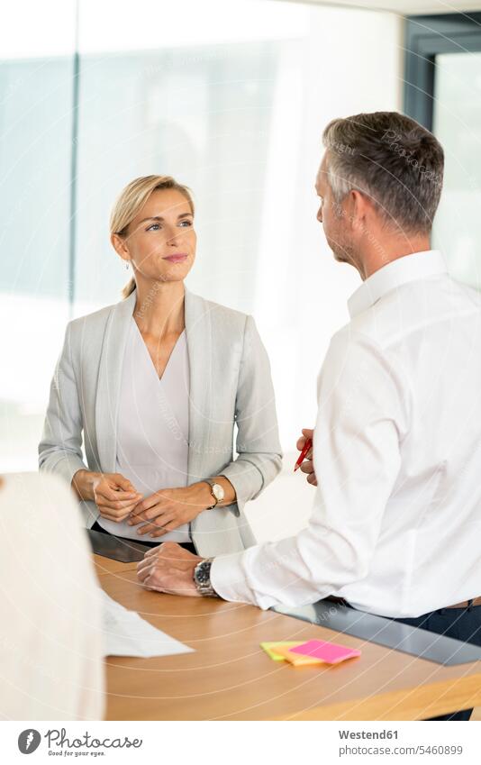 Senior businessman and woman leading workshop in office human human being human beings humans person persons caucasian appearance caucasian ethnicity european 2