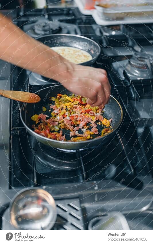 Chef preparing a dish in restaurant kitchen human human being human beings humans person persons 1 one person only only one person adult grown-up grown-ups