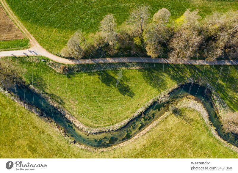 Germany, Baden-Wurttemberg, Lautertal, Aerial view of countryside dirt road stretching along winding Grosse Lauter river rural scene Non Urban Scene