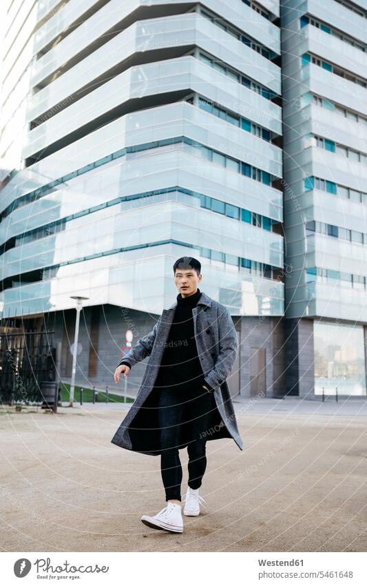 Spain, Barcelona, stylish young man posing on the street men males walking going Adults grown-ups grownups adult people persons human being humans human beings