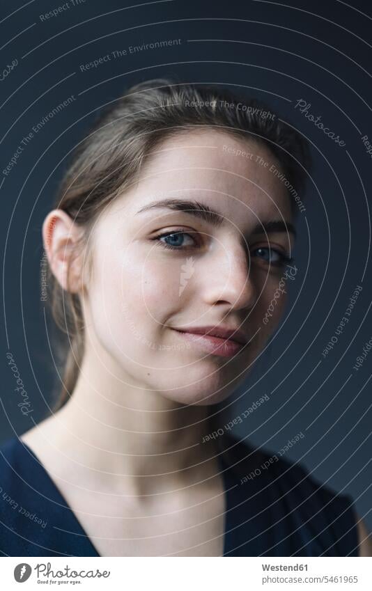 Portrait of smiling young woman against grey background human human being human beings humans person persons caucasian appearance caucasian ethnicity european 1