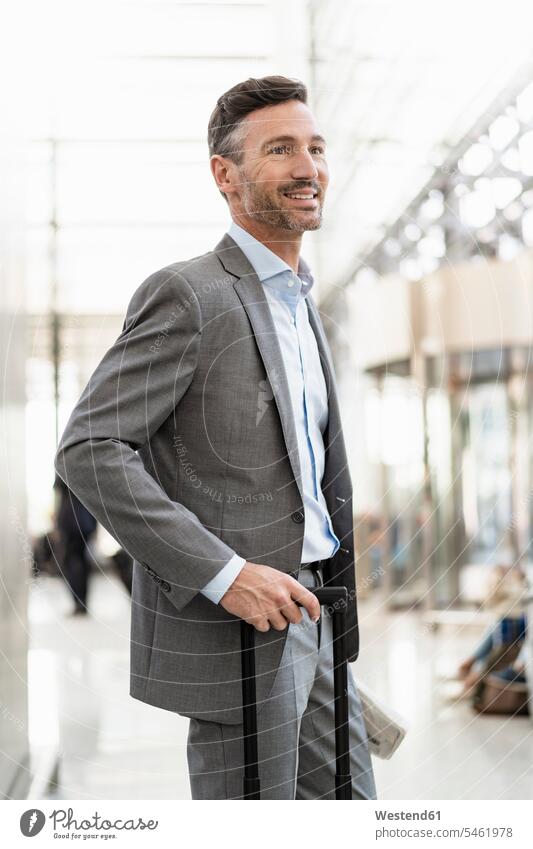 Portrait of smiling businessman with baggage human human being human beings humans person persons caucasian appearance caucasian ethnicity european 1