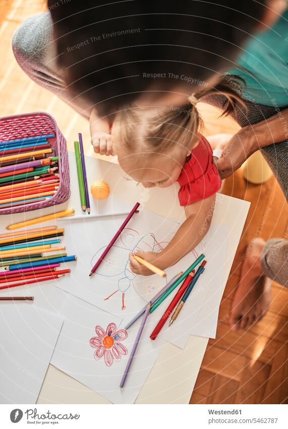 Image of Cute little girl drawing with pencils and colours-LW695413-Picxy