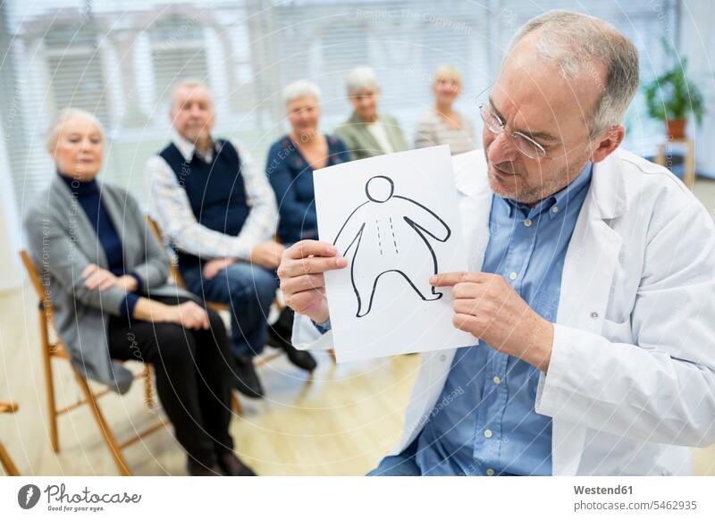 Group of seniors attending health counselling in retirement home - a  Royalty Free Stock Photo from Photocase