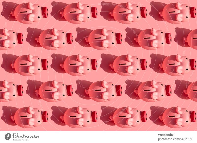 Seamless pattern of rows of piggy banks against pastel pink background pastels Pastel Colored Pink background coloured background colored background