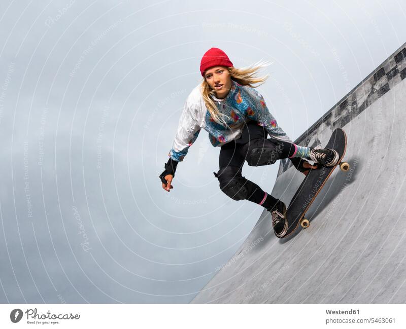 Germany, Baden-Wurttemberg, Waiblingen, Young woman skateboarding in skate park square orientation square format square orientations squares Square Image