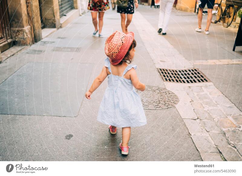 France, Aix-en-Provence, toddler girl walking down the streets of the city center town cities towns going baby girls female outdoors outdoor shots location shot