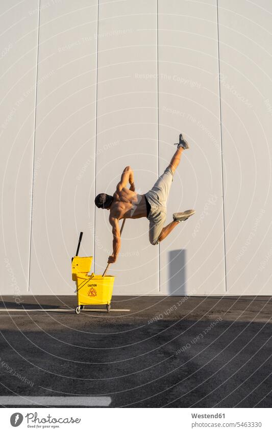 Acrobat standing on ladder, juggling - a Royalty Free Stock Photo from  Photocase