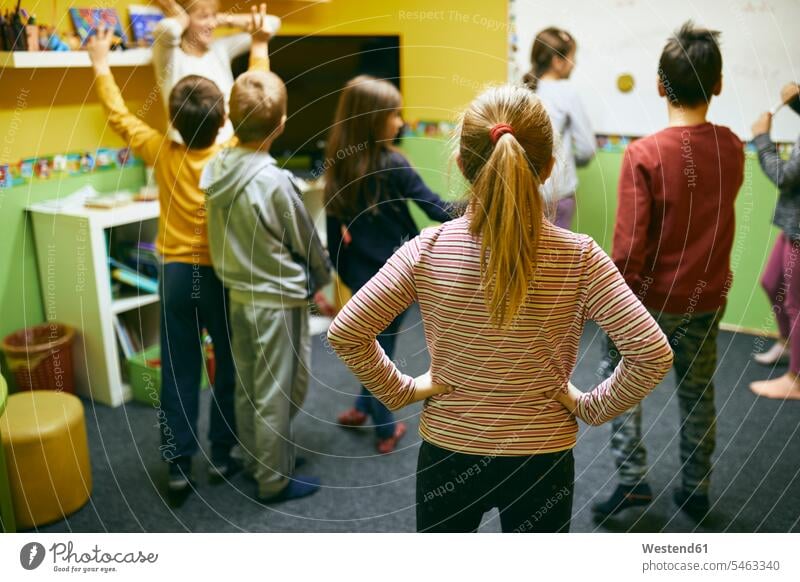 Teacher with students in relaxation room with whiteboard teacher instructor teachers blackboard blackboards school schools relaxation rooms white board