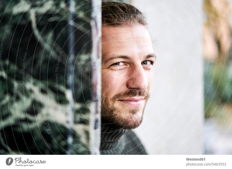 Portrait of bearded young man smiling portrait portraits men males smile Adults grown-ups grownups adult people persons human being humans human beings