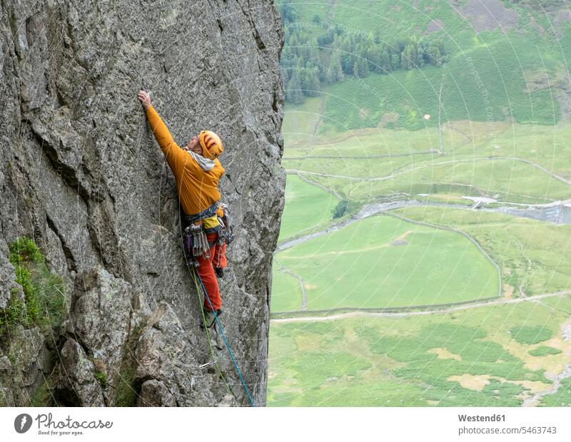 United Kingdom, Lake District, Langdale Valley, Gimmer Crag, climber on rock face rock climber Risk risky rock wall escarpment rocks climbing