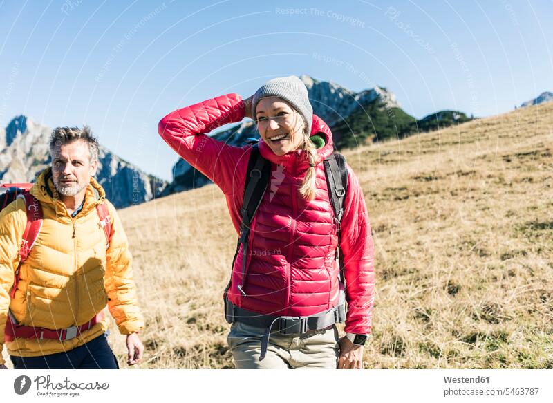 Happy couple hiking on the mountains Royalty Free Vector