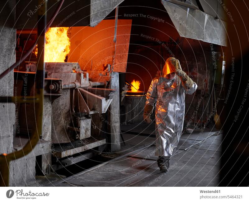 Industry, worker at furnace during melting copper, wearing a fire proximity suit Austria Competence Skill smeltery Blast Furnace Protective Workwear
