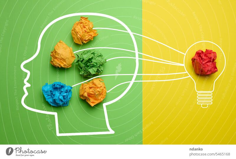 Head silhouette with crumpled paper balls, concept of searching for new ideas business creative head nobody yellow colorful success solution inspiration green
