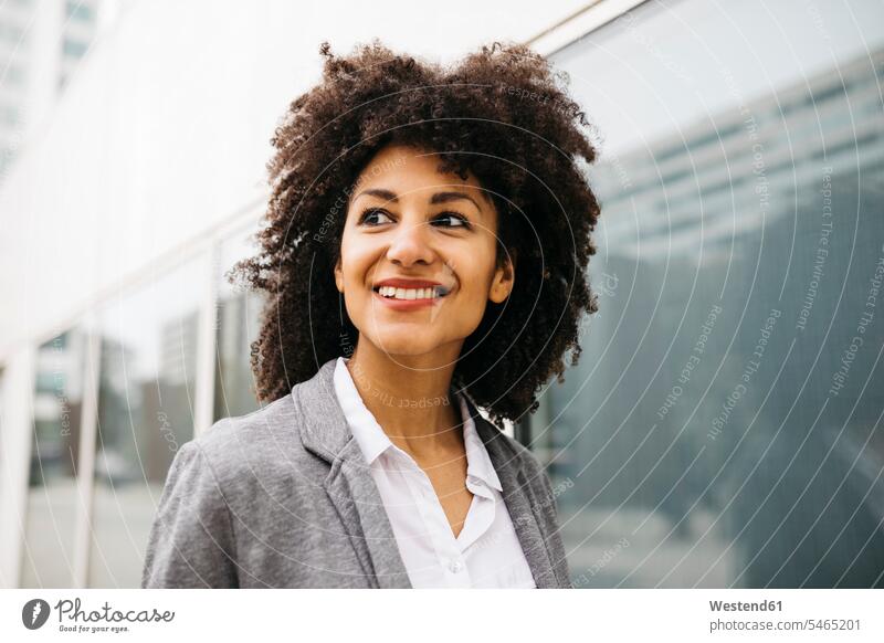 Portrait of happy woman with curly hair portrait portraits females women Adults grown-ups grownups adult people persons human being humans human beings beauty