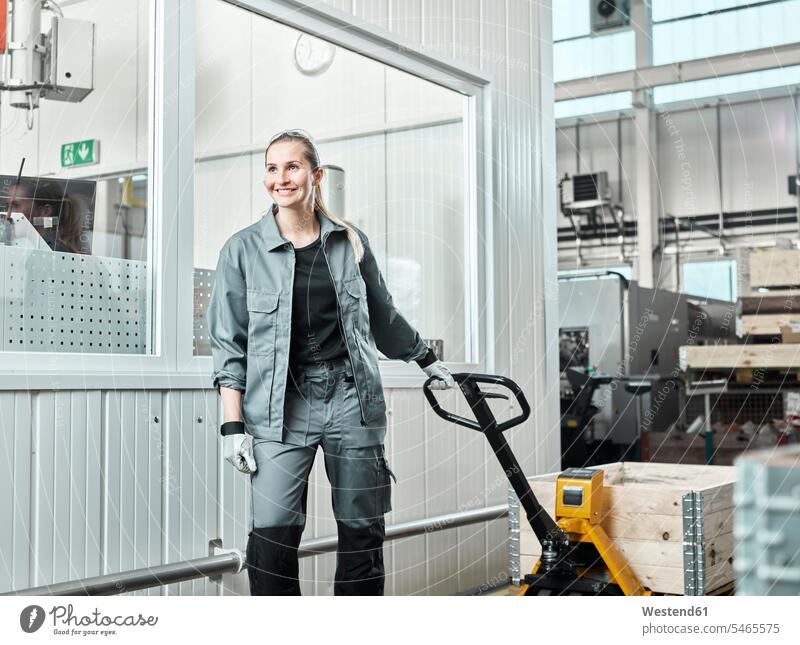 Industry, woman using pallet jack Northern European Ethnicity caucasian caucasian ethnicity caucasian appearance male profession occupation