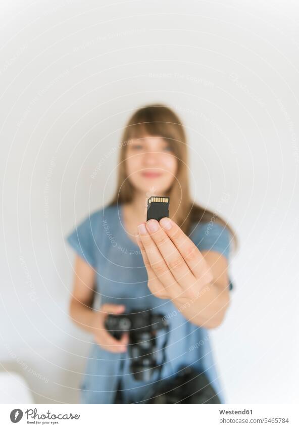 Woman's hand holding memory card, close-up human human being human beings humans person persons caucasian appearance caucasian ethnicity european 1