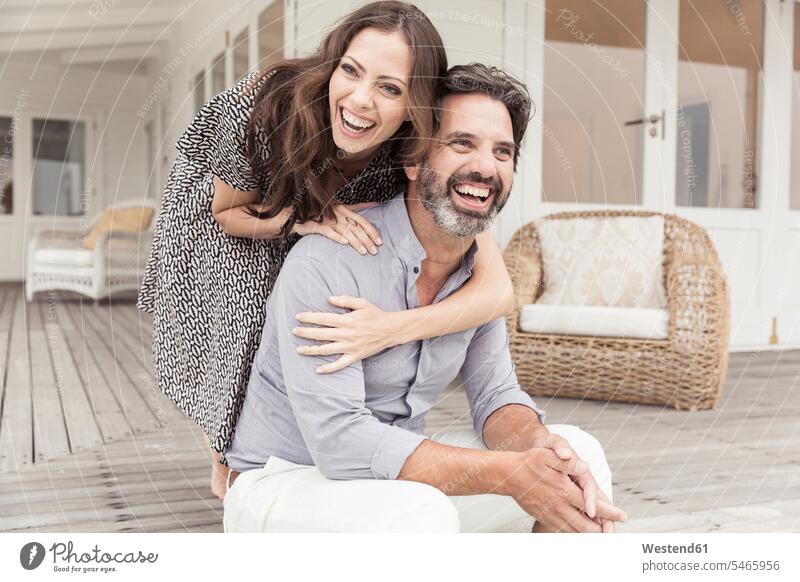 Happy couple on veranda of a vacation home human human being human beings humans person persons caucasian appearance caucasian ethnicity european 2 2 people