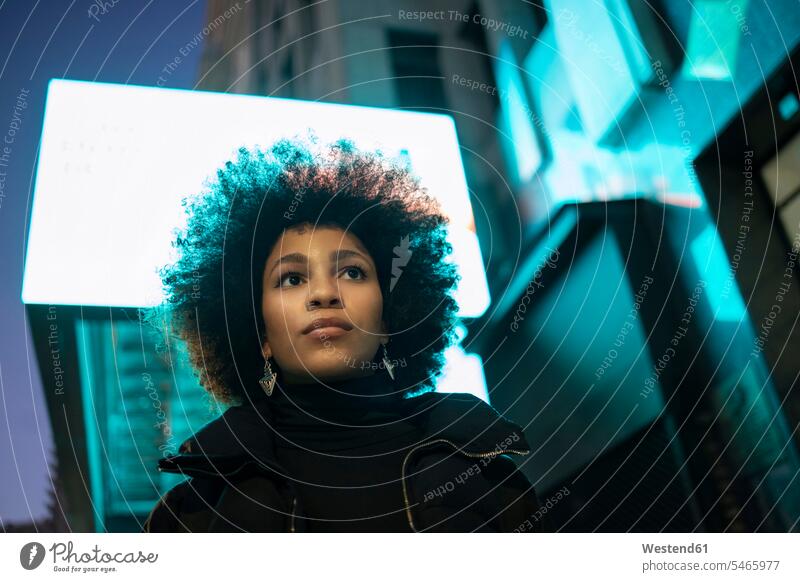 Young woman with afro hairstyle in city color image colour image outdoors location shots outdoor shot outdoor shots African-American Ethnicity Afro-American