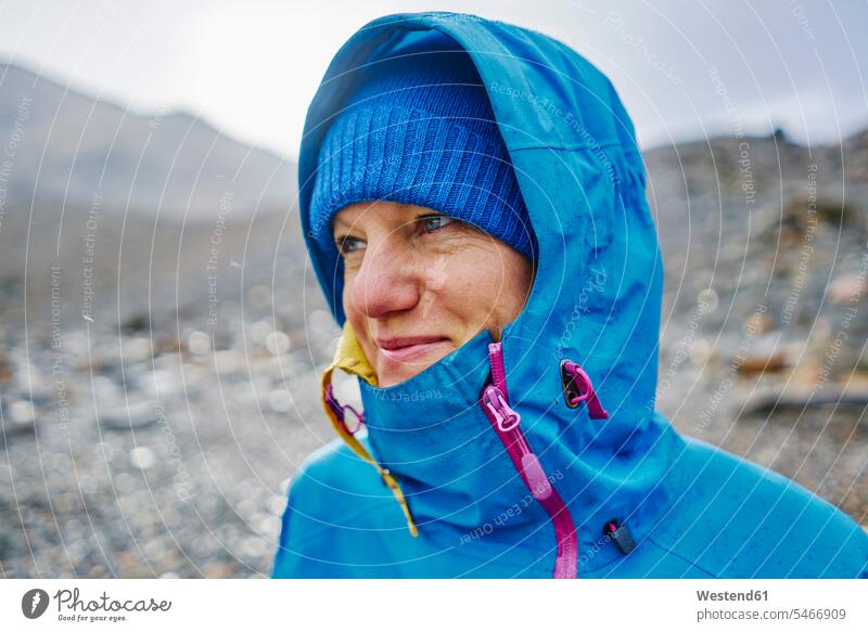 Argentina, Patagonia, El Chalten, portrait of woman in raincoat at