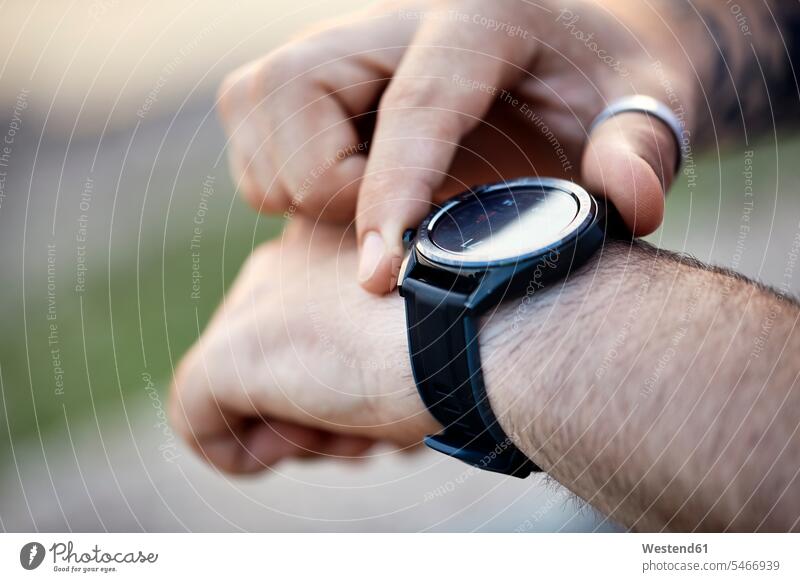 Close-up of man checking smartwatch human human being human beings humans person persons caucasian appearance caucasian ethnicity european 1 one person only