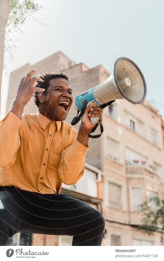 Mature man using megaphone and screaming Contemporary indoor interior shot indoors interiour photo interiour photos interiour shots cutout cutouts cut out