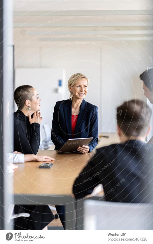 Businesswoman leading a meeting in office Occupation Work job jobs profession professional occupation business life business world business person