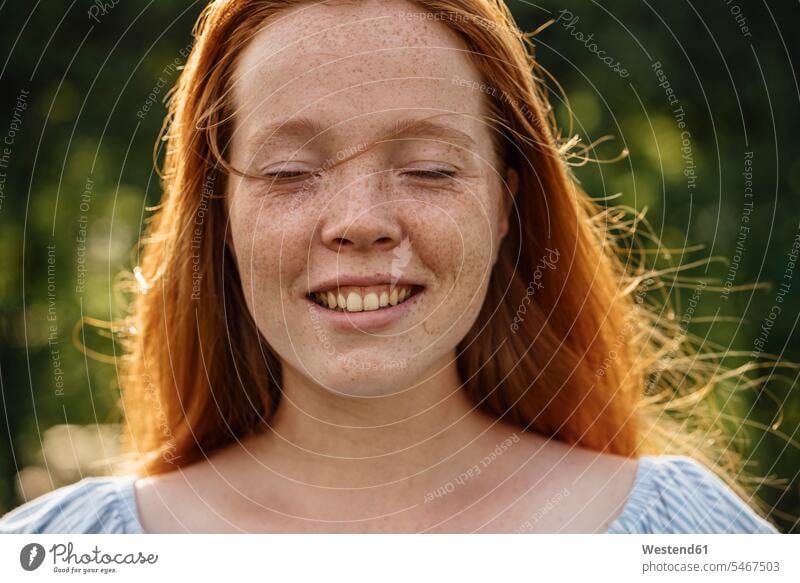 Portrait of redheaded girl woman females women face faces red hair red hairs red-haired freckles freckled smiling smile eyes closed closed eyes Eyes Shut