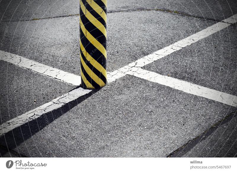 No, you're not a complete idiot. Asphalt Marking lines Crossed Blocking post ram protection Barrier posts Striped Black Yellow warning marking Road marking