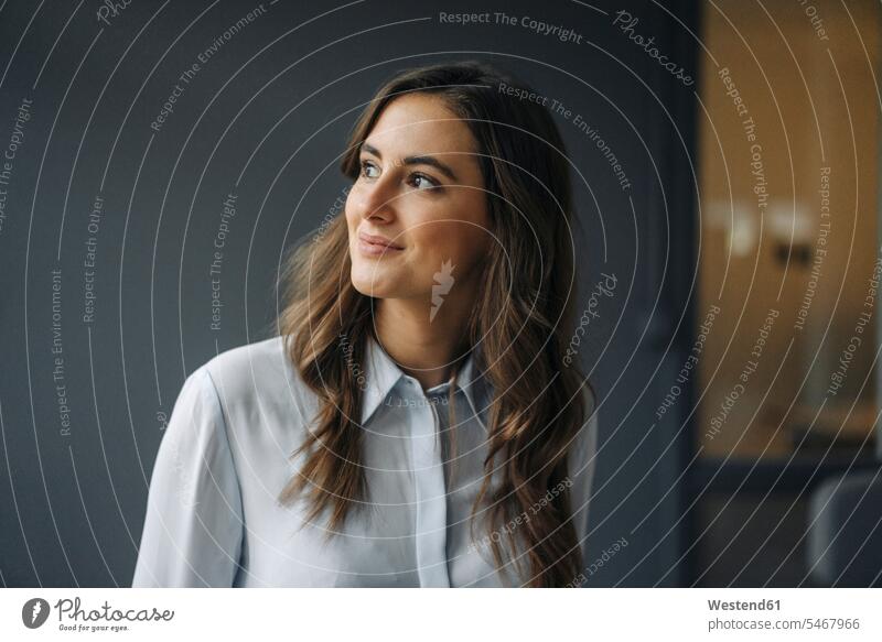 Portrait of smiling young businesswoman looking sideways caucasian caucasian ethnicity caucasian appearance european copy space portrait portraits optimistic