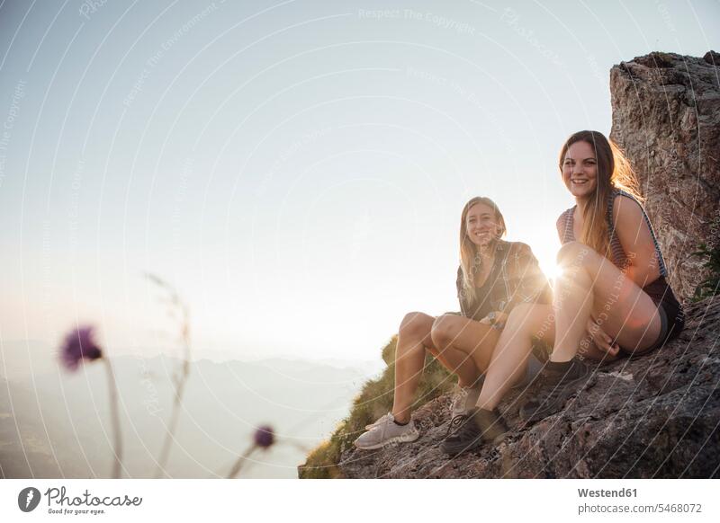 Switzerland, Grosser Mythen, two happy girlfriends on a hiking trip having a break at sunrise excursion Getaway Trip Tours Trips Girlfriends girl friend