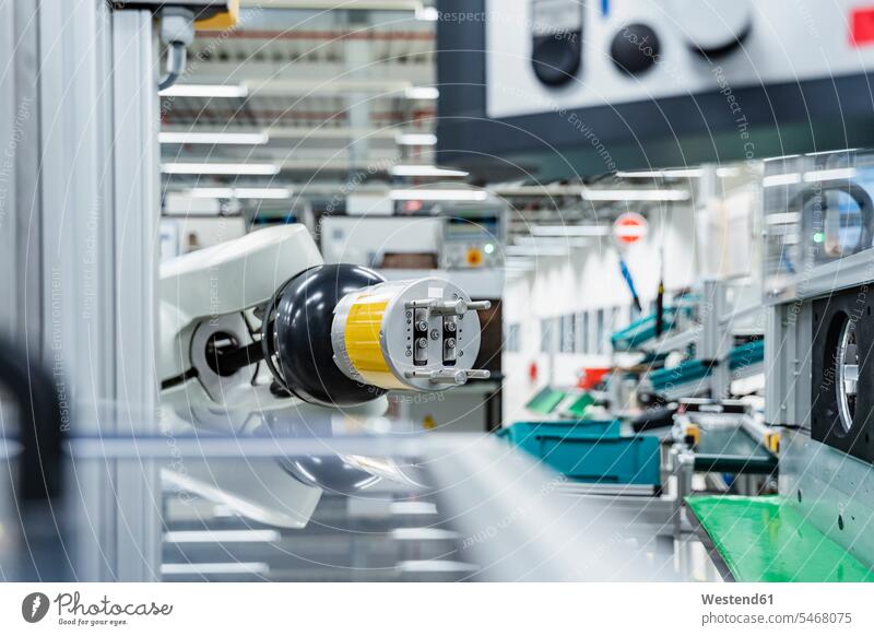 Arm of assembly robot functioning inside modern factory, Stuttgart, Germany indoors indoor shot indoor shots interior interior view Interiors production line