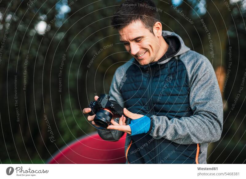 Man camping in Estonia, looking at his camera holding nature natural world tent tents confidence confident independence independent tranquility tranquillity