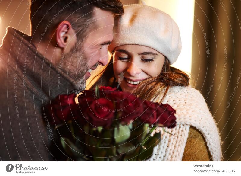 Couple in love with bunch of red roses in winter hibernal couple twosomes partnership couples Bunch of Flowers Bouquet Flower Bouquet Bouquet of Flowers