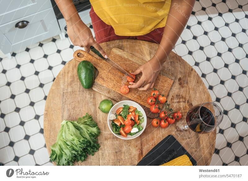 Close-up of woman in kitchen preparing healthy meal human human being human beings humans person persons African black black ethnicity coloured 1