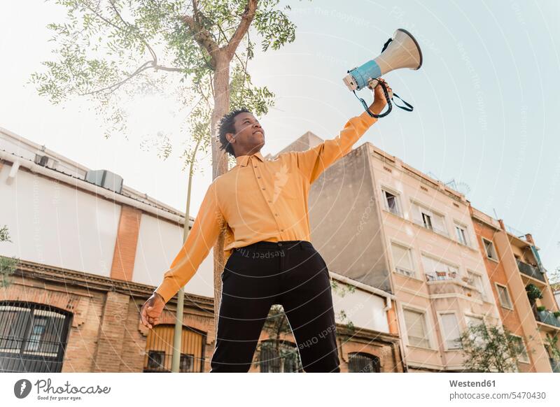 Mature man using megaphone and screaming indoor interior shot indoors interiour photo interiour photos interiour shots Contemporary cutout cutouts cut out