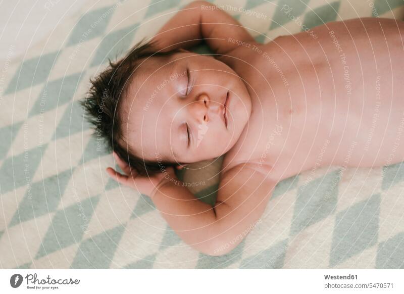 Portrait of a newborn baby boy lying on a blanket with closed eyes portrait portraits laying down lie lying down Blanket Blankets newborns newborn child infants