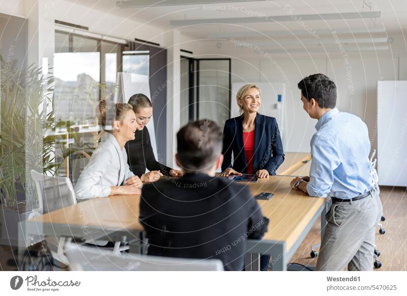Businesswoman leading a meeting in office Occupation Work job jobs profession professional occupation business life business world business person