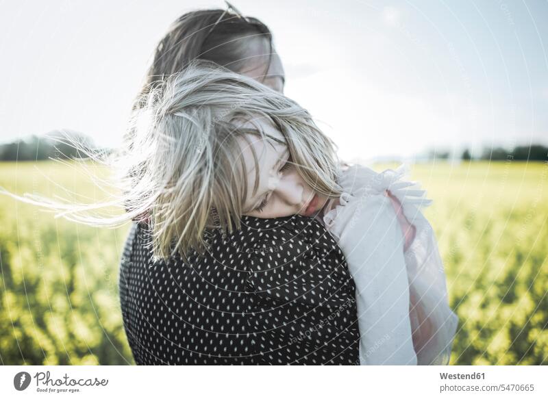 Portrait of little girl on her mother's arms in rape field canola fields Rapeseed Field rape fields portrait portraits mommy mothers ma mummy mama females girls