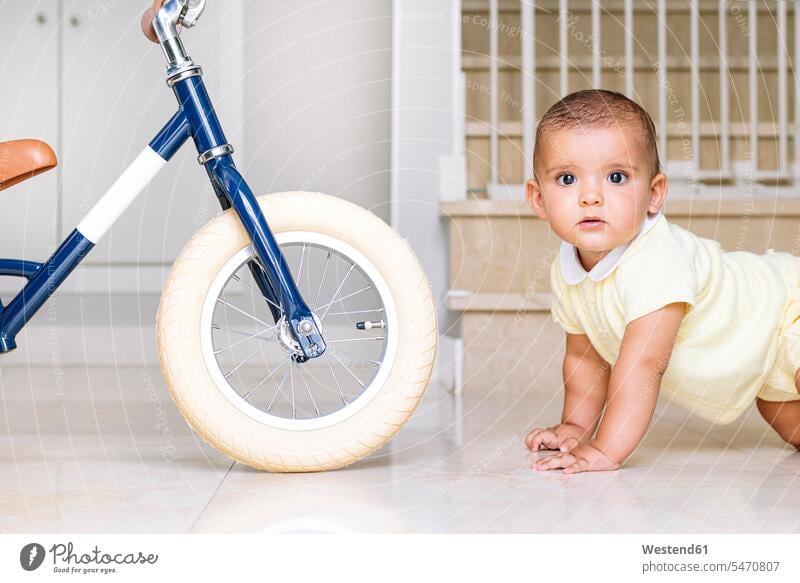 Cute baby crawling on floor at home color image colour image indoors indoor shot indoor shots interior interior view Interiors day daylight shot daylight shots