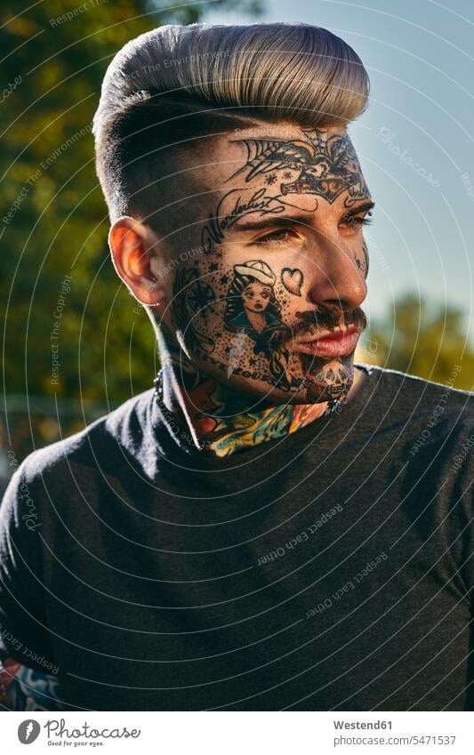 Portrait of tattooed young man outdoors tattoos men males portrait portraits body art Body Adornment Skin Art style stylish Adults grown-ups grownups adult