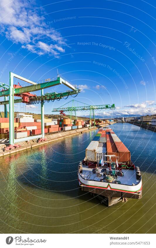 Germany, Baden-Wurttemberg, Stuttgart, Container ship at commercial dock on bank of Neckar river outdoors location shots outdoor shot outdoor shots day