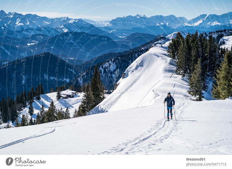 Germany, Bavaria, Brauneck, man on a ski tour in winter in the mountains hibernal men males Ski Touring ski tours Adults grown-ups grownups adult people persons