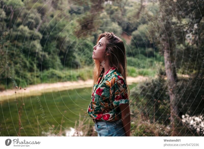 Young woman surrounded by nature females women natural world Surrounding Adults grown-ups grownups adult people persons human being humans human beings blond