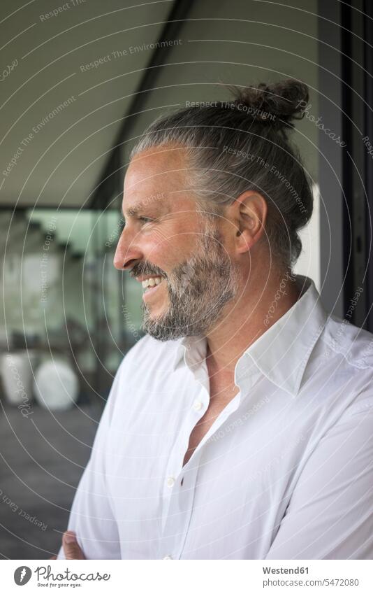 Portrait of happy mature man with hair bun human human being human beings humans person persons caucasian appearance caucasian ethnicity european 1