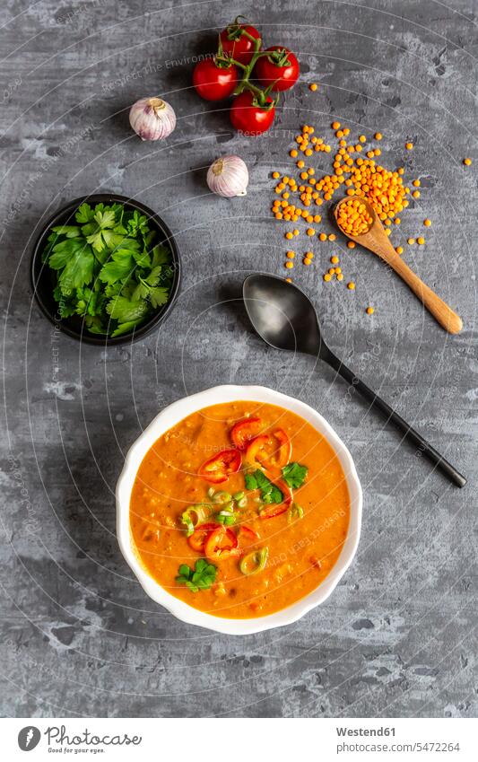 Soup bowl of garnished red lentil soup and ingredients vegetarian Vegetarian Food ready to eat ready-to-eat still life still-lifes still lifes