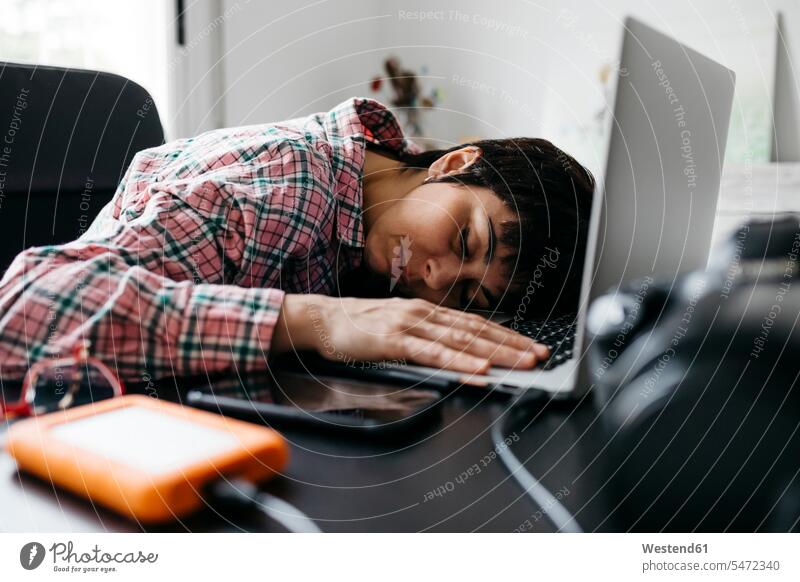 Overworked woman sleeping on laptop in home office human human being human beings humans person persons caucasian appearance caucasian ethnicity european