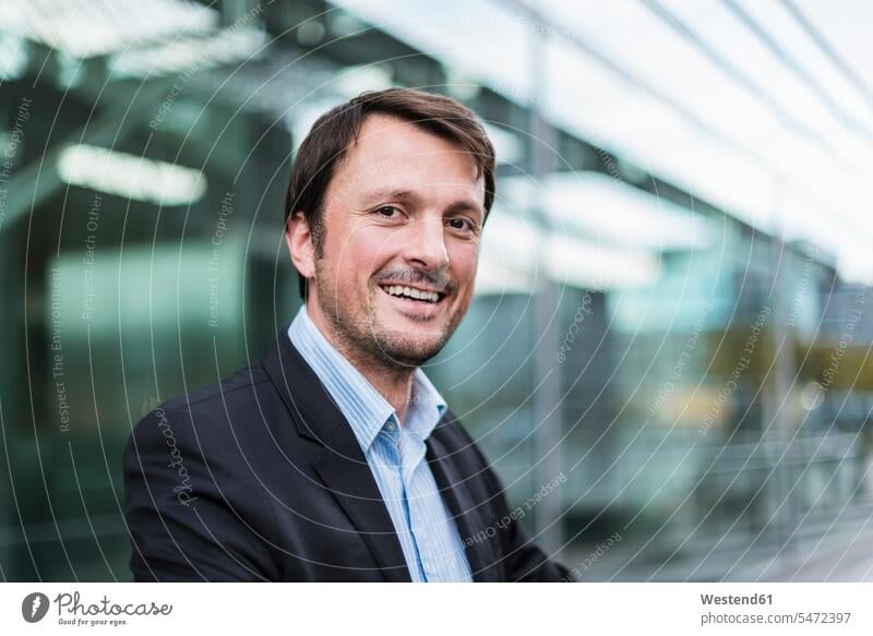 Portrait of a busiessman at the airport terminal airports Businessman Business man Businessmen Business men portrait portraits transportation business people