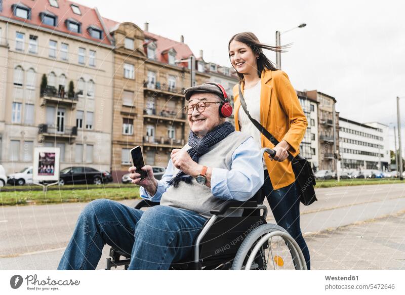 Senior Couple Man In Wheelchair Window Shopping Stock Photo - Download  Image Now - Community Outreach, Disability, Pushing - iStock